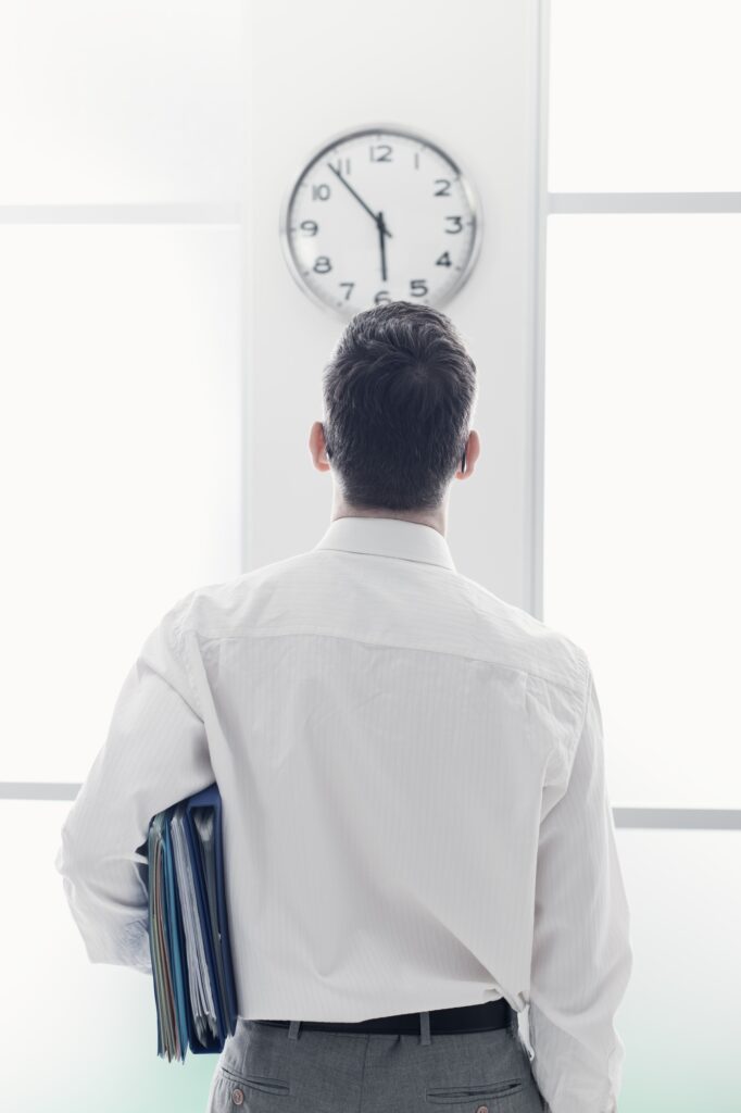 Businessman staring at the clock