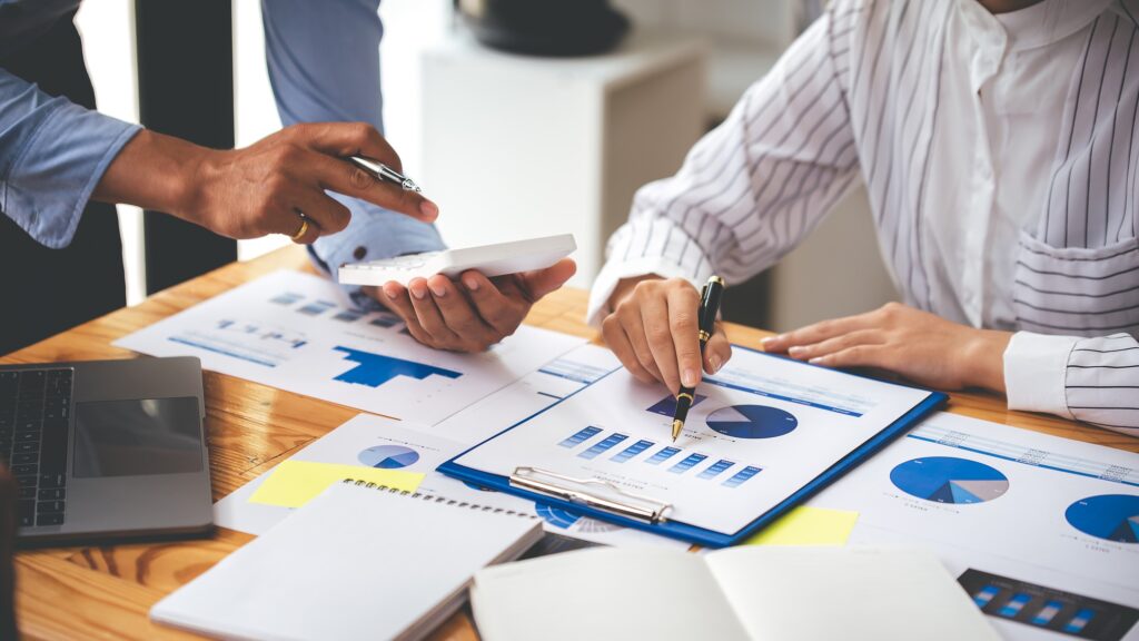 Team work with business analytic price chart on the table at the conference room.