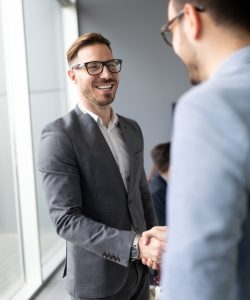 Business people shaking hands, finishing up meeting