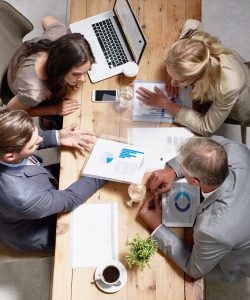 High angle shot of a group of businesspeople having a discussion in an office